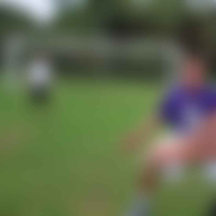Ultimate Frisbee player executing a Scoober Throw